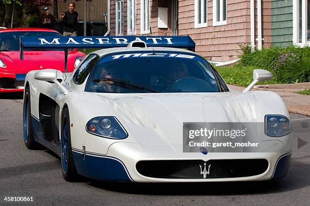 maserati mc-12 driving in downtown charlottetown, pe - maserati mc12 stock pictures, royalty-free photos & images