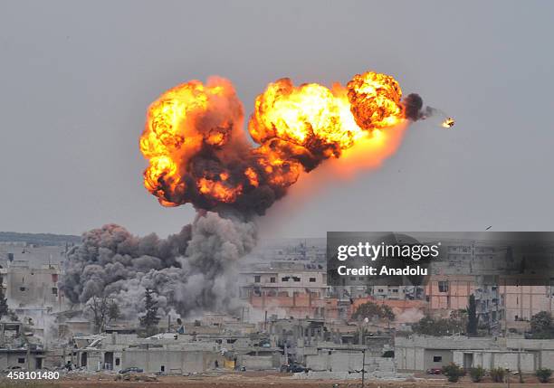 Photograph taken from Suruc district of Sanliurfa, Turkey, near Turkish-Syrian border crossing shows smoke rising from the Syrian border town of...