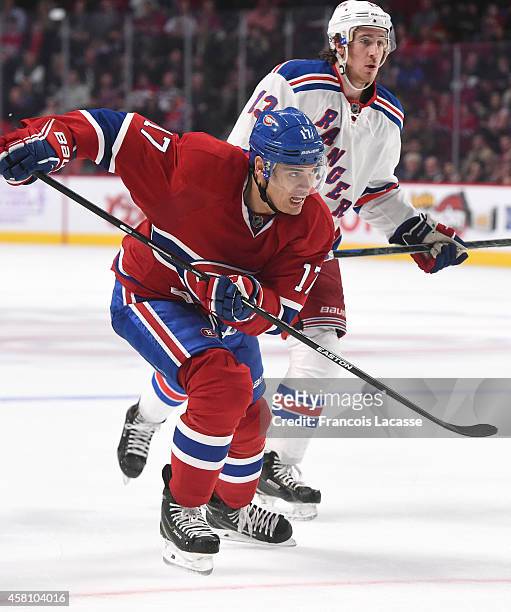 Rene Bourque of the Montreal Canadiens skates for the puck against the New York Rangers in the NHL game at the Bell Centre on October 25, 2014 in...