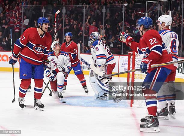 Max Pacioretty of the Montreal Canadiens celebrates with Dale Weise after scoring a goal against of the New York Rangers in the NHL game at the Bell...