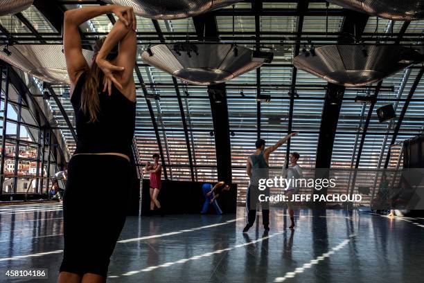 Dancers rehearse on September 1, 2014 at the dance studio inside Lyon's Opera. The 16th edition of the "Biennale de la Danse de Lyon" festival ,...