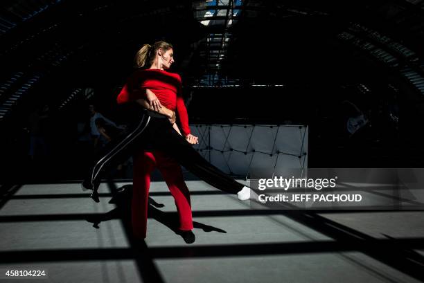 Dancers rehearse on September 1, 2014 at the dance studio inside Lyon's Opera. The 16th edition of the "Biennale de la Danse de Lyon" festival ,...