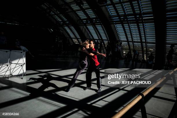 Dancers rehearse on September 1, 2014 at the dance studio inside Lyon's Opera. The 16th edition of the "Biennale de la Danse de Lyon" festival ,...