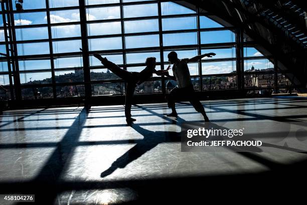 Dancers rehearse on September 1, 2014 at the dance studio inside Lyon's Opera. The 16th edition of the "Biennale de la Danse de Lyon" festival ,...