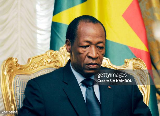 Burkina Faso's President Blaise Compaore waits prior to meeting relatives and acquaintances of the victims of the Air Algerie crash at the...