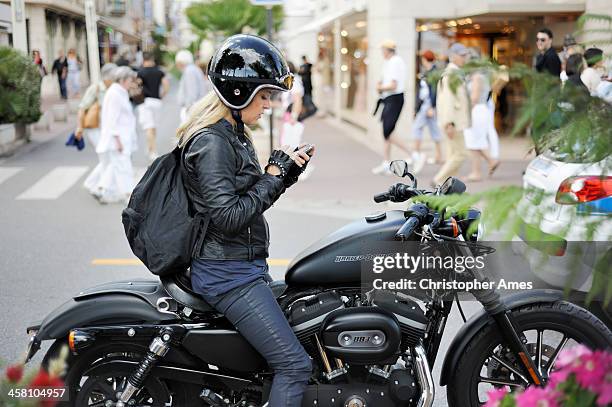 girl on a motorcycle at cannes - harley davidson woman stock pictures, royalty-free photos & images