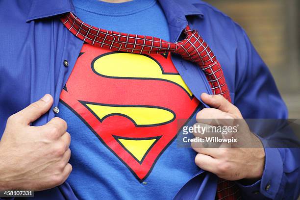 superman costume on strong young man - dc comics stock pictures, royalty-free photos & images