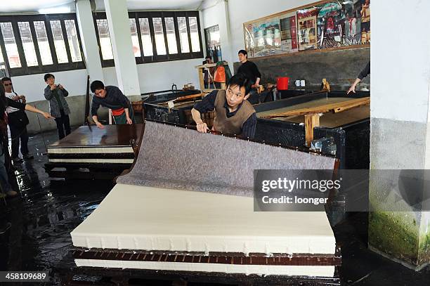 traditional chinese papermaking - paper factory machine stock pictures, royalty-free photos & images