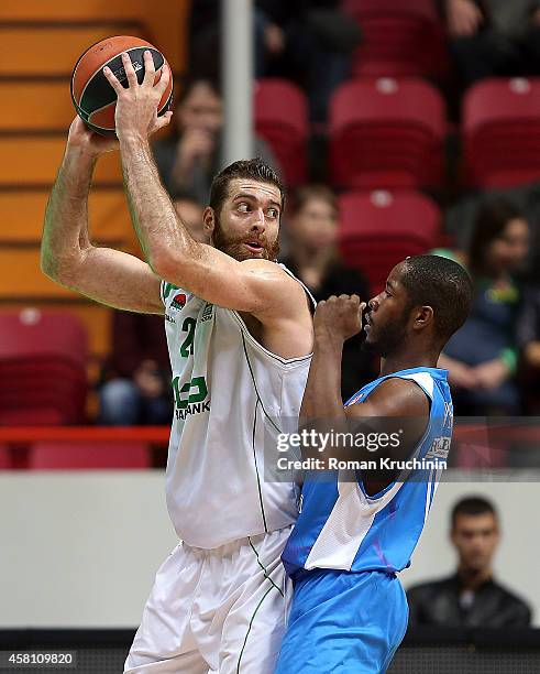 Kostas Kaimakoglou, #21 of Unics Kazan competes with Jerome Dyson, #11 of Dinamo Banco di Sardegna Sassari during the 2014-2015 Turkish Airlines...