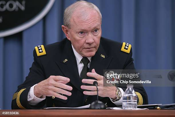 Chairman of the Joint Chiefs of Staff Gen. Martin Dempsey answers reporters' questions during a news conference at the Pentagon October 30, 2014 in...