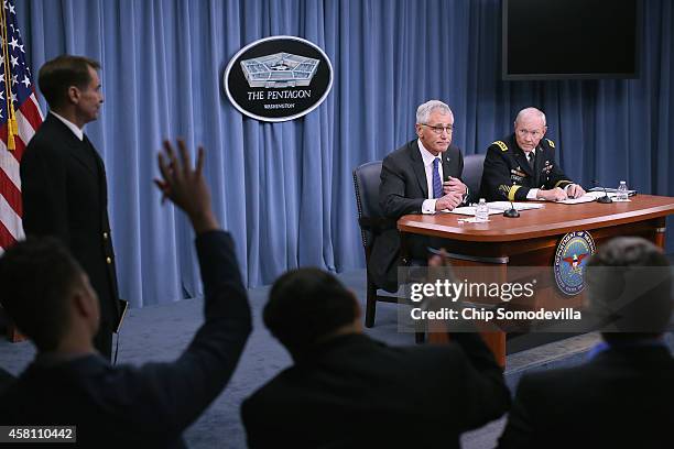 Defense Secretary Chuck Hagel and Chairman of the Joint Chiefs of Staff Gen. Martin Dempsey hold a news conference at the Pentagon October 30, 2014...