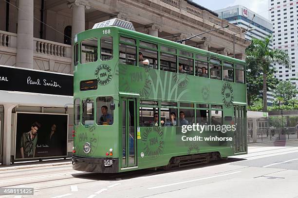 double-decker tram in central district, hong kong. - double decker bus stock pictures, royalty-free photos & images