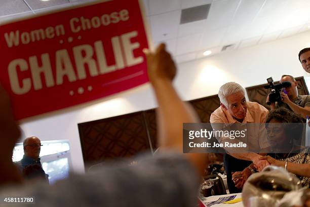 Former Florida Governor and now Democratic gubernatorial candidate Charlie Crist greets people as he attends a campaign event at the Century Village...