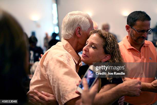 Former Florida Governor and now Democratic gubernatorial candidate Charlie Crist hugs Rep. Debbie Wasserman Schultz , the Chair of the Democratic...