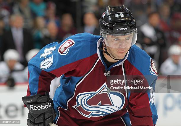 Alex Tanguay of the Colorado Avalanche pauses during a break in the action against the San Jose Sharks at the Pepsi Center on October 28, 2014 in...
