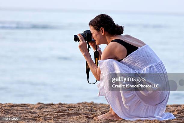 woman photographer - nikon stock pictures, royalty-free photos & images
