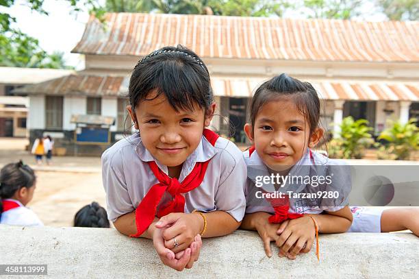 pupil girls smiling - laos stock pictures, royalty-free photos & images
