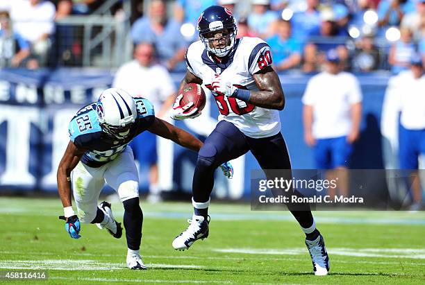 Wide receiver Andre Johnson of the Houston Texans carries the ball during a NFL game against the Tennessee Titans at LP Field on October 26, 2014 in...