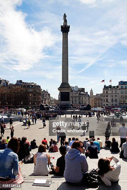 nelson's monument and trafalgar square - lion monument stock pictures, royalty-free photos & images