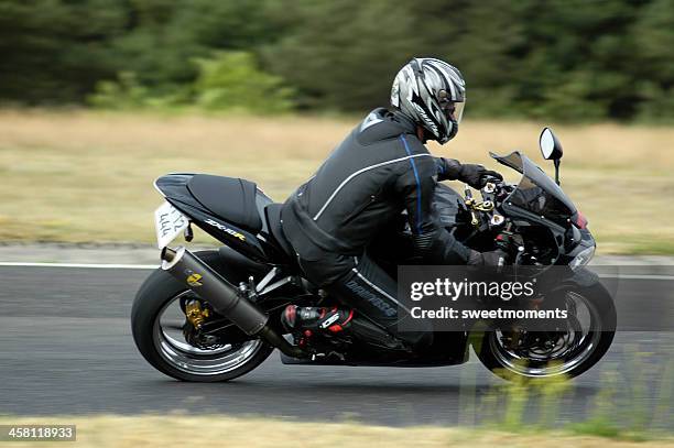 fast motorcycle - motorcycle chase stock pictures, royalty-free photos & images