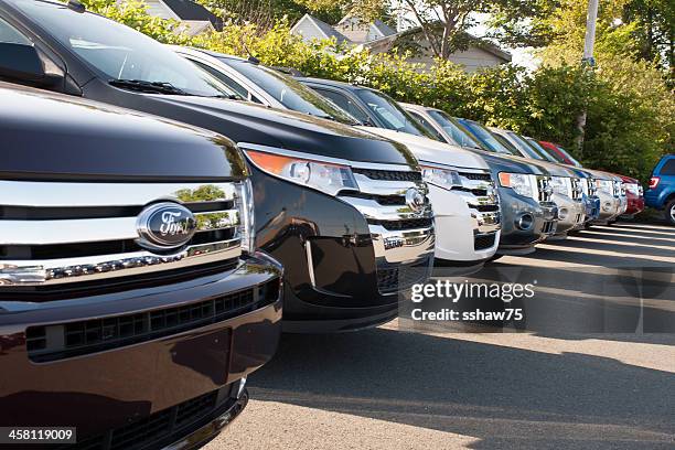new 2011 ford suvs on dealership lot - white ford truck stock pictures, royalty-free photos & images