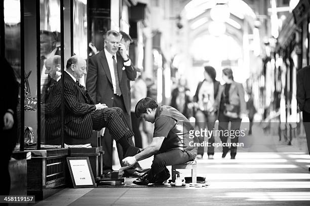 shoe shiner in the burlinton arcade - polishing shoes stock pictures, royalty-free photos & images