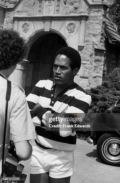 Hugh Hefner hosts his guest NFL player and actor O.J. Simpson at the Playboy Mansion in May, 1979 in Los Angeles, California.