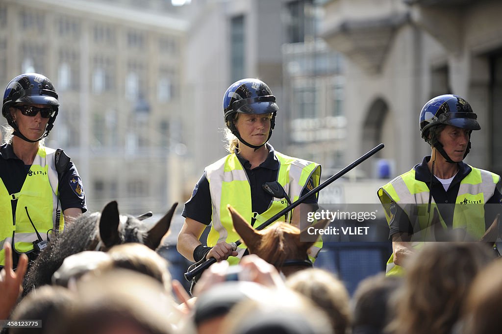 Mounted police officers at a public protest in The Hague