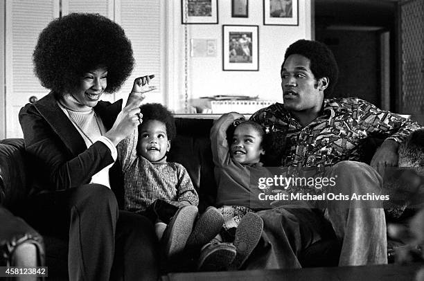 Star O.J. Simspson sits with his wife Marguerite Simpson, daughter Arnelle and son Jason during a portrait session on January 8, 1973 in Los Angeles,...