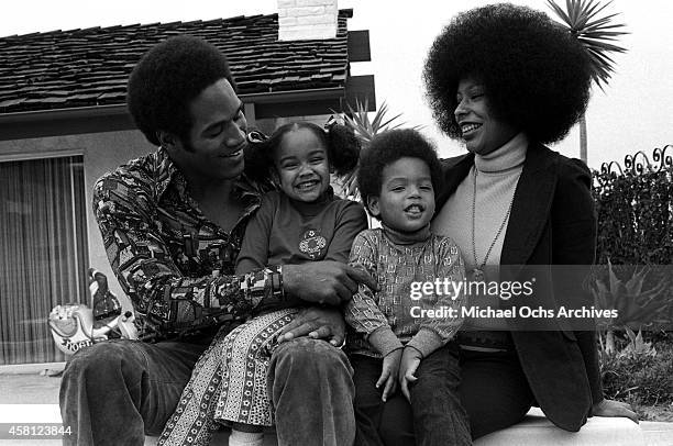 Star O.J. Simspson sits with his wife Marguerite Simpson, daughter Arnelle and son Jason pose for a portrait at home on January 8, 1973 in Los...