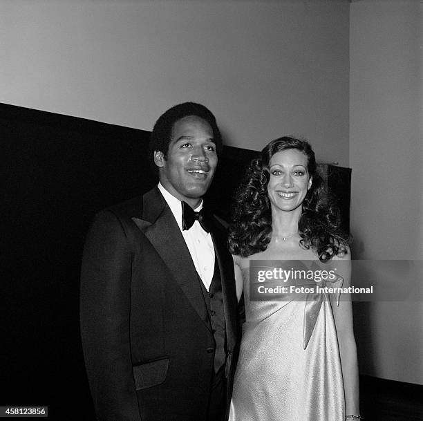 Player and actor O.J. Simpson and actress Marisa Berenson pose for a portrait before presenting for Short Film on March 29, 1976 at the Dorothy...