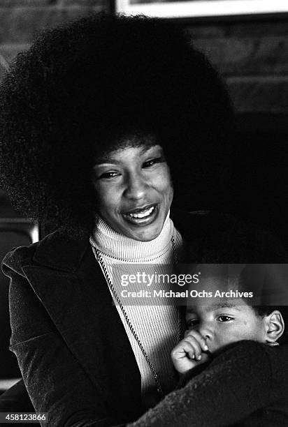 Marguerite Simpson, wife of O. J. Simpson, poses for a portrait at home on while holding her son Jason on January 8, 1973 in Los Angeles, California.