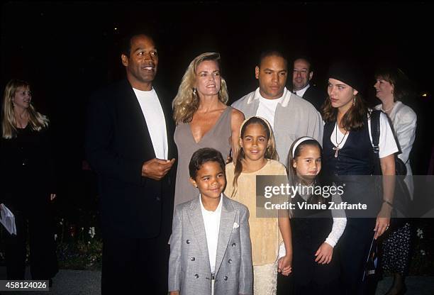 Simpson, Nicole Brown Simpson, Jason Simpson, Sydney Brooke Simpson, Justin Ryan Simpson pose at the premiere of the "Naked Gun 33 1/3: The Final...