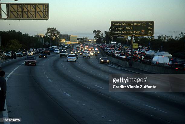 Police cars pursue the Ford Bronco driven by Al Cowlings, carrying fugitive murder suspect O.J. Simpson, on a 90-minute slow-speed car chase June 17,...