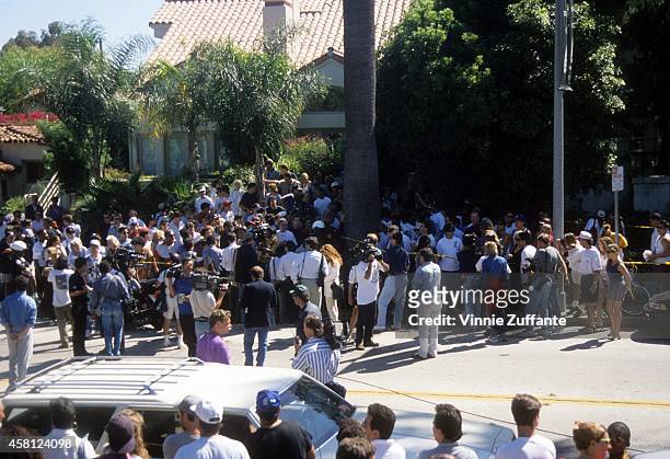 Media gathers at the Brentwood condo where Nicole Brown Simpson and Ron Goldman were stabbed to death a day earlier on June 13, 1994 in Brentwood,...