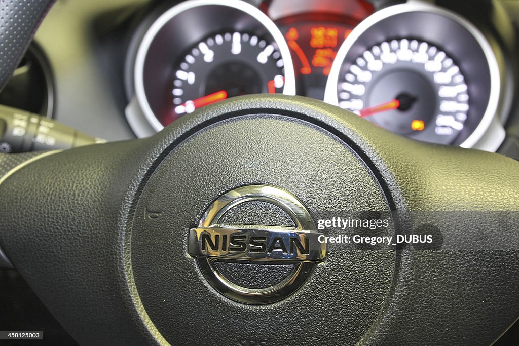 Nissan logo on a car steering wheel