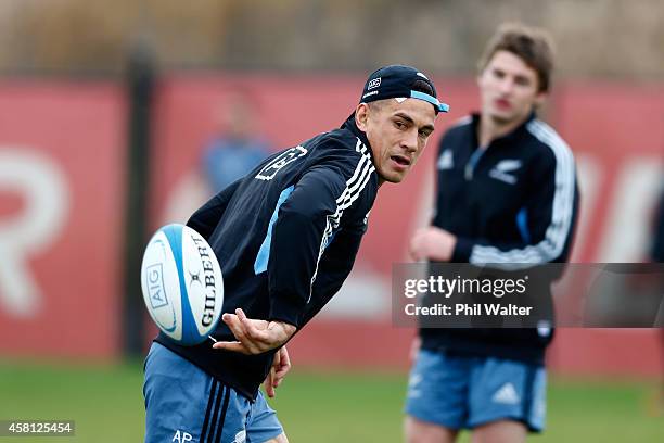 Sonny Bill Williams of the All Blacks offloads the ball during a New Zealand All Blacks training session at Toyota Park on October 30, 2014 in...