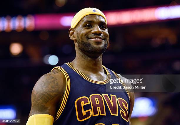 LeBron James of the Cleveland Cavaliers smiles after a play in the second quarter against the New York Knicks at Quicken Loans Arena on October 30,...