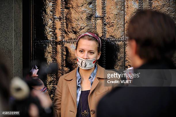 occupy amsterdam protestor in front of stock exchange entrance - election sadness stock pictures, royalty-free photos & images
