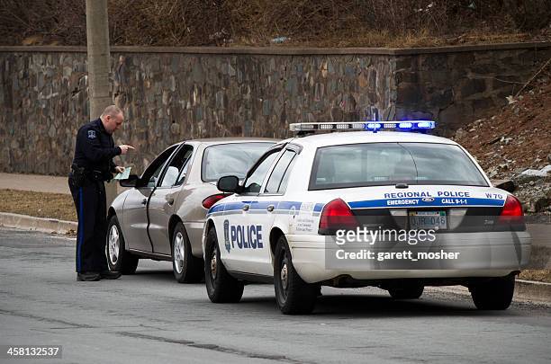 halifax police officer giving motorist a ticket - pulled over by police stock pictures, royalty-free photos & images