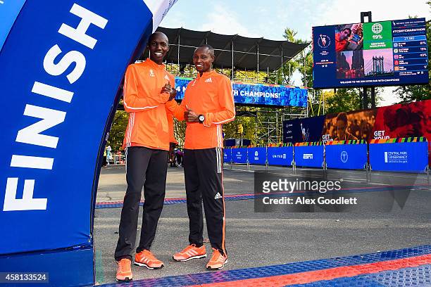 Wilson Kipsang poses for a picture with Geoffrey Mutai at the TCS New York City Marathon finish line on October 30, 2014 in New York City.