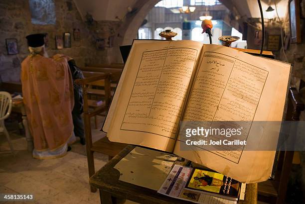 arab church and arabic prayer book in zababdeh, palestine - greek orthodox stock pictures, royalty-free photos & images