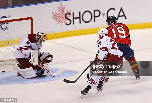 Scottie Upshall of the Florida Panthers scores the go ahead goal during a game against the Arizona Coyotes at BB&T Center on October 30, 2014 in...