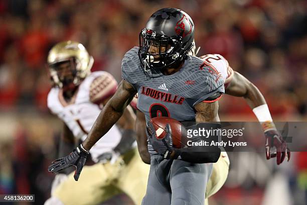 DeVante Parker of the Louisville Cardinals catches a 51 yard pass in the fourth quarter thrown by Will Gardner against the Florida State Seminoles...