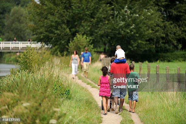 people strolling along the river kromme rijn in summer - kromme stock pictures, royalty-free photos & images