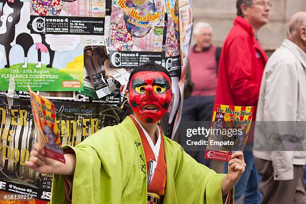 leaflet distributor at edinburgh fringe festival. - edinburgh international festival stock pictures, royalty-free photos & images