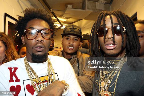 Trey Songz poses with hip hop group Migos at the 2014 Power 105.1 Powerhouse concert at Barclays Center on October 30, 2014 in the Brooklyn borough...