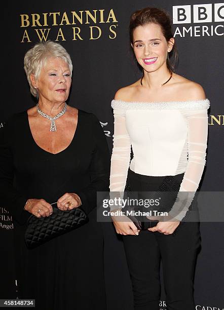 Dame Judi Dench and Emma Watson arrive at the BAFTA Los Angeles Jaguar Britannia Awards held at The Beverly Hilton Hotel on October 30, 2014 in...