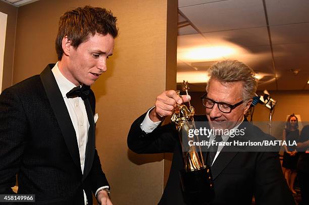 Actors Eddie Redmayne and Dustin Hoffman attend the BAFTA Los Angeles Jaguar Britannia Awards presented by BBC America and United Airlines at The...