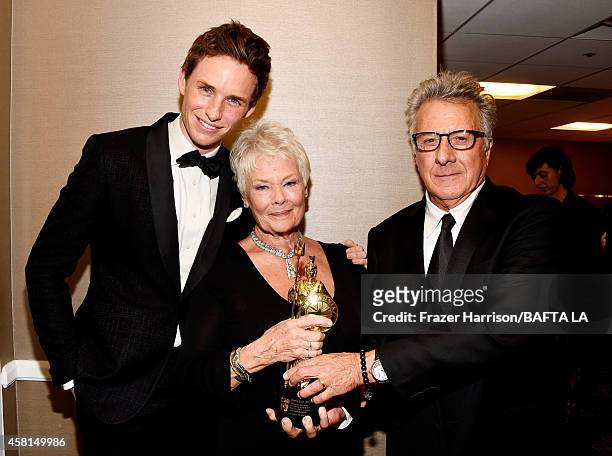 Actors Eddie Redmayne, honoree Dame Judi Dench, and Dustin Hoffman attend the BAFTA Los Angeles Jaguar Britannia Awards presented by BBC America and...
